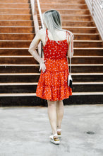 Load image into Gallery viewer, back of red floral dress with tie straps and zipper
