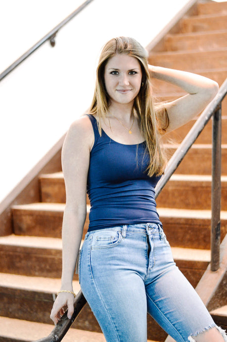 Women's blue seamless sugarlips tank top. Paired with medium wash distressed ankle skinny jeans. 