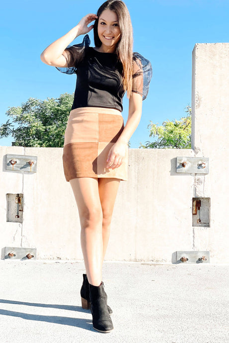 Brown color block mini suede a-line skirt with zip closure. Paired with a Black puff sleeve blouse