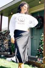Load image into Gallery viewer, women&#39;s black mid length black midi skirt with slit paired with a cropped crewneck white sweatshirt with a cute champagne gang
