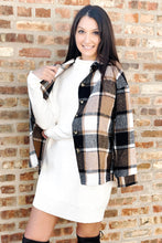 Load image into Gallery viewer, Women&#39;s black plaid long sleeve shacket. Paired with a women&#39;s ivory long sleeve sweater dress and knee high suede boots. 
