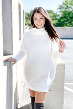 Load image into Gallery viewer, Women&#39;s white oversized long sleeve turtleneck sweater dress.  Paired with suede knee high boots. 
