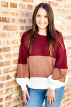 Load image into Gallery viewer, Women&#39;s color block sweater. Paired with women&#39;s medium wash ripped ankle skinny jeans. 
