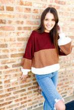 Load image into Gallery viewer, Women&#39;s color block sweater. Paired with medium wash distressed skinny jeans. 
