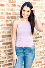 Load image into Gallery viewer, women&#39;s striped tank tops. Purple and white striped tank top with ruching and side ties. Paired with medium wash high waisted distressed ankle skinny jeans. 
