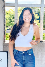 Load image into Gallery viewer, white ribbed crop tank top with deep v neck paired with denim shorts
